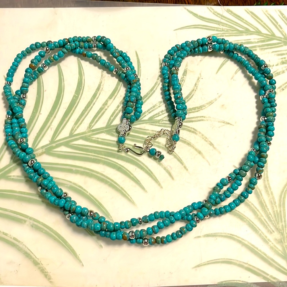 Multi strand faux turquoise beaded necklace.